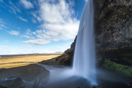 One of the most famous waterfalls in Iceland called Seljalandsfoss is located in the Golden Circle and is easy accessible from the Ring Roadの写真素材