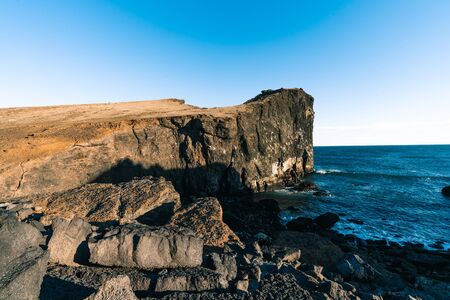 Marvelous sunset on popular tourist attraction Valahnukamol bay in southern Iceland. Cliffs are located in Reykjanes peninsula and are easily accessible from Keflavik or Reykjavik the capital cityの写真素材
