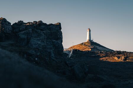A popular Icelandic lighthouse Reykjanesviti is easily accessible from Reykjavik the capital town of Iceland. Golden hour at the Reykjanes peninsula. Tourism in Icelandの写真素材