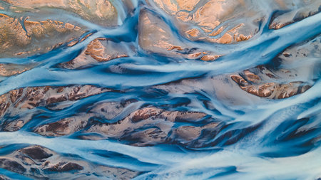A glacial rivers from above. Aerial photograph of the river streams from Icelandic glaciers. Beautiful art of the Mother nature created in Iceland. Wallpaper background high quality photoの写真素材