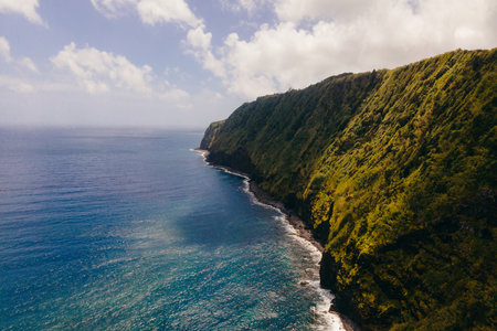Farol do Arnel is a graceful lighthouse on Sao Miguel Island, Azores, guiding seafarers with its luminous presence and maritime history. High quality photoの写真素材
