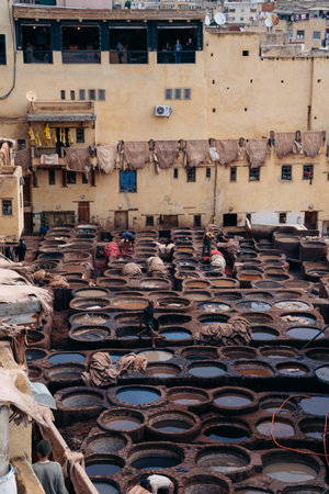 15.5.2023 Fes, Morocco: A famous Chouara tannery in Fes, Morocco, showcasing the ancient art of leather dyeing using natural techniques and vibrant colors. High quality photoのeditorial素材