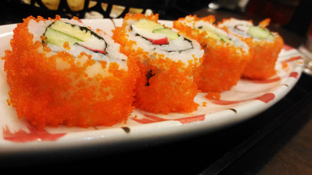 Sushi roll with chopsticks isolated on restaurant restaurantの写真素材