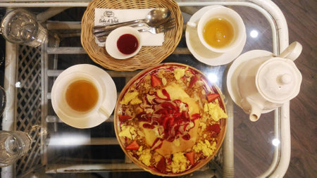Cake and Pastries > Bright afternoon tea table, with antique English bone china floral pattern tea set.の写真素材