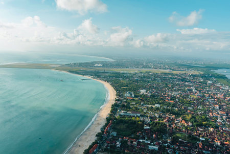 Aerial view of the sea and the city of Bali, Indonesiaの写真素材