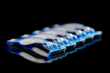 Five Disposable Razors on Black Backgroundの写真素材