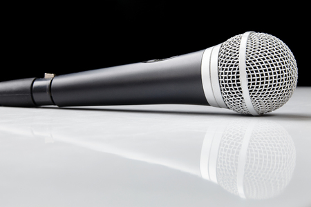Voice microphone on a white plastic with reflectionの写真素材