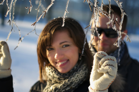 Young Couple Out of Focus With Birch Hoared Branchの写真素材