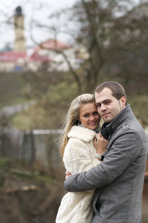 Young Happy Woman And Man Over Background With Old Towerの写真素材