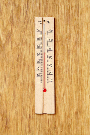 Wooden Alcohol Thermometer Over Wooden Boardの写真素材