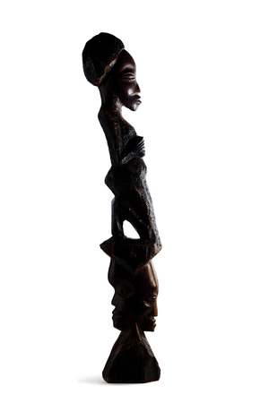 Silhouette of African Figurine Half-Face Over White Backgroundの写真素材