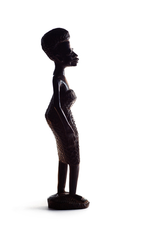 Silhouette of African Statue of Girl Over White Backgroundの写真素材