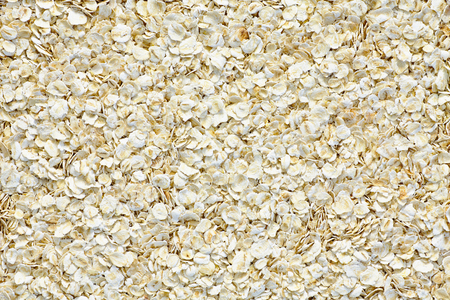 Oat flakes close up raw food textureの写真素材