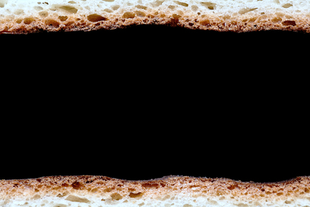 Frame of Two Slices of White Bread Macro as Borders Isolated over Black Background Close-Upの写真素材