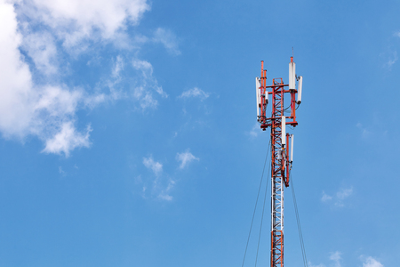 Technology on the top of the telecommunication GSM (5G,4G) tower with copy space. Cellular phone antennas on a building roofの写真素材
