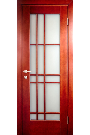 Wooden interior door of rosewood or palisander wood with brass handle and insets of frosted glass with ornament isolated on white backgroundの写真素材