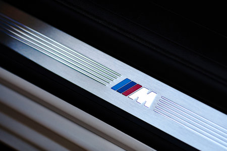 Grodno, Belarus, May 6, 2013: Symbol of the BMW M on the threshold in BMW 750 Li xDrive. Badge of BMW M series.のeditorial素材