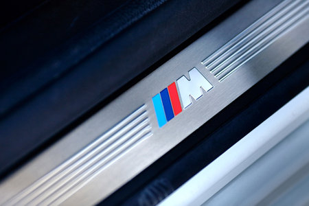 Grodno, Belarus, May 6, 2013: Symbol of the BMW M on the threshold in BMW 750 Li xDrive. Badge of BMW M series.のeditorial素材