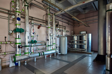 System of distribution of coolant through pipes, distribution of steam and hot water through comb boiler room of  plant with valves fittings.の写真素材
