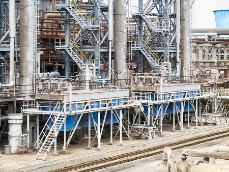 At modern chemical plant. Air cooling system with electric motors and synthesis columns of chemical production.の写真素材