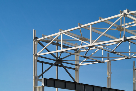 Background with metal structures fire protection coating over clear deep blue sky with copy space.の写真素材