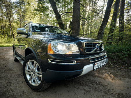 GRODNO, BELARUS - MAY 2015: Volvo XC90 4.4 v8 1st generation restyling 4WD SUV test drive in spring forest country road wide shot side bottom view in Grodno Belarusのeditorial素材