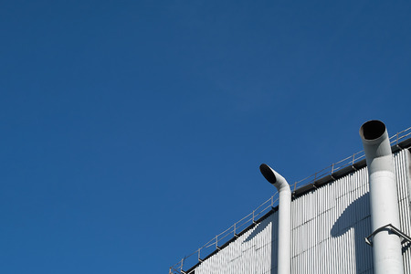 Bright air separation plant at bright sunny day over deep deep blue sky background with copy space.の写真素材