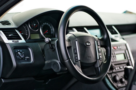 Grodno, Belarus, December 2012: Land Rover Range Rover Sport 5.0L V8 Supercharged. Modern luxury prestige car interior dashboard speedometer tachometer with steering wheel with cruise controller.のeditorial素材