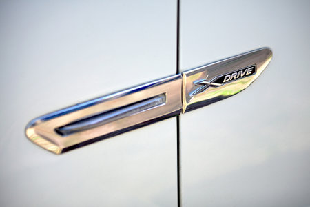Grodno, Belarus, May 16, 2013: Modern luxury BMW 750Li XDrive  xdrive metal logo selective focus close-up.のeditorial素材