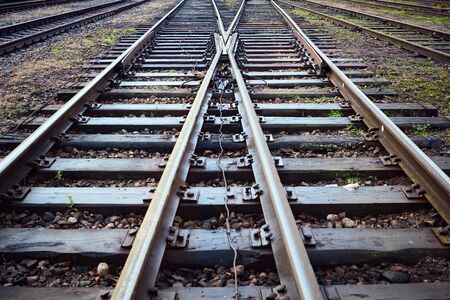 Large empty railroad crossing without fork. Concept of industrial logistic and transportation background with selected focus on intersection with copy space.の写真素材