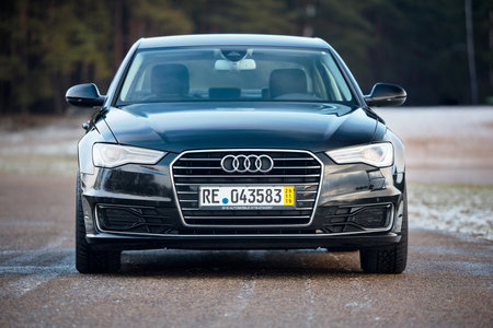 GRODNO, BELARUS - DECEMBER 2019: Audi A6 4G, C7 2.0 TDI 190 Hp 2016 outdoors on winter road during testdrive with forest on backgroundのeditorial素材