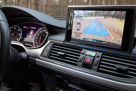 GRODNO, BELARUS - DECEMBER 2019: Audi A6 4G, C7 2.0 TDI 190 Hp 2016 during testdrive Interior with rearview camera dynamic trajectory turning lines and parking assistant steering wheel turned leftのeditorial素材