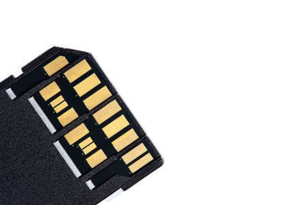 Macro Diagonal photo of two rows of golden contacts on back of UHS-II high speed memory card isolated on white background close up. Fast modern memory storage disk for 4K 6K or 8K video recording.の写真素材