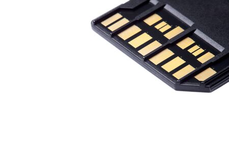 Selective focus photo of two rows of golden contacts on back of UHS-II high speed memory card isolated on white background close up. Fast modern memory storage disk for 4K 6K or 8K video recording.の写真素材