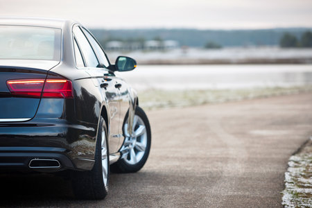 GRODNO, BELARUS - DECEMBER 2019: Audi A6 4G, C7 2.0 TDI 190 Hp 2016 facelift rear outdoors on winter road during testdrive with forest on background.のeditorial素材