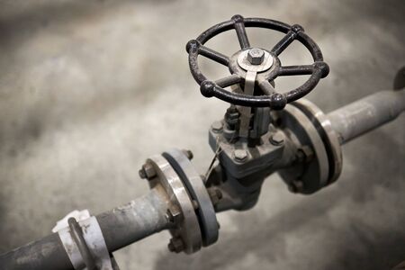 Close-up of industrial valve with focus on foreground ventil with copy space.の写真素材