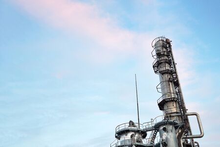 Oil refinery chemical plant bottom view with copy space against evening sky.の写真素材
