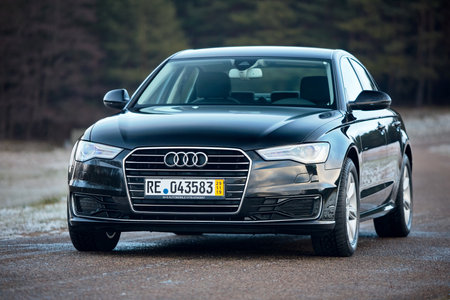GRODNO, BELARUS - DECEMBER 2019: Audi A6 4G, C7 2.0 TDI 190 Hp 2016 outdoors on winter road during testdrive with forest on background.のeditorial素材