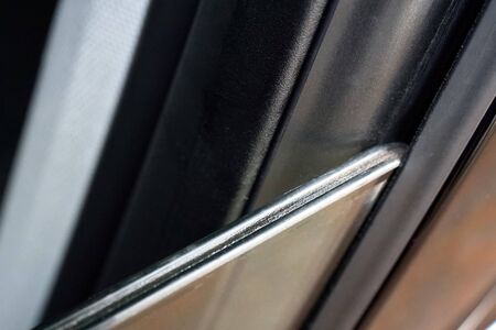 Double pane window or double glassed or double glazed window with two slates of glass of luxury modern car, as method of noise protection or reducing cabin noise by using two slabes of glassの写真素材
