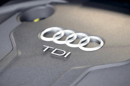 GRODNO, BELARUS - DECEMBER 2019: Audi A6 4G, C7 2.0 TDI 190 Hp 2016 Audi TDI sign logo into diesel motor compartment of modern luxury car with sunlightのeditorial素材