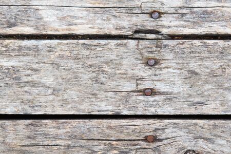 Old wooden background with horizontal weathered boards and rusty nailsの写真素材