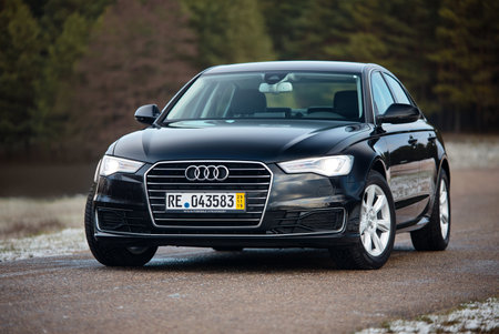 GRODNO, BELARUS - DECEMBER 2019: Audi A6 4G, C7 2.0 TDI 190 Hp 2016 outdoors on winter road during testdrive with forest on background.のeditorial素材