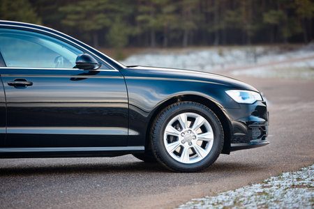 GRODNO, BELARUS - DECEMBER 2019: Audi A6 4G, C7 2.0 TDI 190 Hp 2016 front half outdoors on winter road during testdrive with forest on background.のeditorial素材