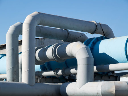 Tangle of pipes. Concept of complexity of petrochemical industry communications. Pipe weaving of...