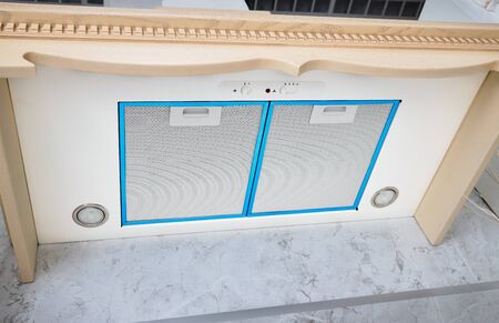Modern air exhauster kitchen fan or Range Hood with LED lamps and blue Aqua Menthe borders. Stainless Steel Chimney Hood with Metal Pipe. Cooker Hoodの写真素材