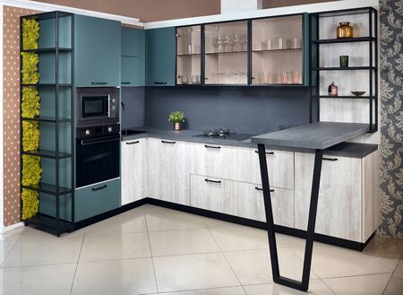 Upscale Aqua Menthe kitchen in luxury home with breakfast bar counter flat wooden panels designの写真素材