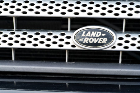 Grodno, Belarus, December 2012: Dirt sand and dust cover LAND ROVER logo on car body. Concept of the offroad SUV.のeditorial素材