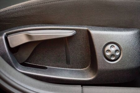 Car inside Velours Seats with Adjustment Memory Knob. Modern Transportation. Interior of prestige modern car. Textile power-up seat for improved operability of memory electric seats.の写真素材