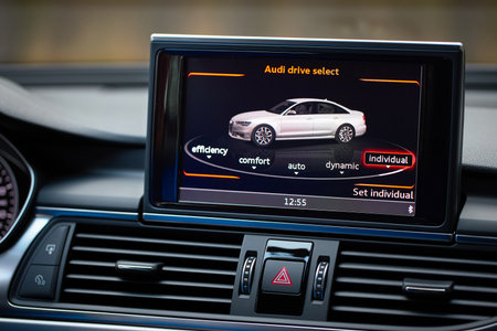 GRODNO, BELARUS - DECEMBER 2019: Audi A6 4G, C7 2.0 TDI 2016 Interior with selecting the driving mode monitor display allows driver to choose between comfort auto dynamic and individual driving mode.のeditorial素材
