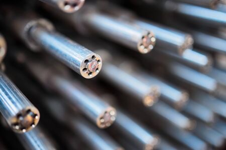 Industrial chemical technology background design selective focus on polished gloss milled tube tip mixer of high-temperature reactor for reaction of steam oxygen and natural gas, with copyspace.の写真素材